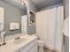 Cozy full bathroom with a white vanity and shower with tub combo at 12819 E Dickensen Pl, Aurora, CO 80014