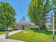 Charming Danbury Park clubhouse featuring a welcoming porch and well-manicured landscaping at 12819 E Dickensen Pl, Aurora, CO 80014