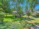 Picturesque community gazebo nestled among mature trees and lush greenery, perfect for outdoor relaxation at 12819 E Dickensen Pl, Aurora, CO 80014