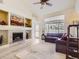 Inviting living room with a fireplace, open layout, and plenty of natural light at 12819 E Dickensen Pl, Aurora, CO 80014