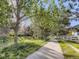 Community walking path surrounded by lush greenery and mature trees, great for an outdoor stroll at 12819 E Dickensen Pl, Aurora, CO 80014