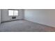 Bright bedroom featuring neutral wall colors and wall-to-wall carpeting at 13601 E Marina Dr # 404, Aurora, CO 80014