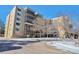Attractive building exterior with landscaping and ample parking at 13601 E Marina Dr # 404, Aurora, CO 80014