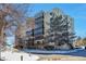 Condo building exterior with landscaping and parking at 13601 E Marina Dr # 404, Aurora, CO 80014