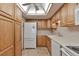 Bright kitchen with wood cabinets and modern appliances at 13601 E Marina Dr # 404, Aurora, CO 80014