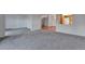 Spacious living room with carpet and access to balcony at 13601 E Marina Dr # 404, Aurora, CO 80014
