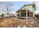 View of backyard featuring a covered porch, steps, and landscaping at 2228 S Eldridge St, Lakewood, CO 80228