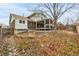 Backyard featuring a covered deck and landscaping at 2228 S Eldridge St, Lakewood, CO 80228