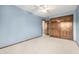 Blue bedroom with closet and ensuite bath at 2228 S Eldridge St, Lakewood, CO 80228