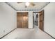 Bedroom with neutral carpet, a ceiling fan, wood trim, a closet, and an open doorway at 2228 S Eldridge St, Lakewood, CO 80228