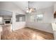 Bright dining area with hardwood floors, a ceiling fan, and natural light at 2228 S Eldridge St, Lakewood, CO 80228