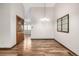 Charming dining room boasts hardwood floors, a hanging light fixture, and built-in display cabinet at 2228 S Eldridge St, Lakewood, CO 80228