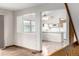 Bright kitchen featuring white cabinetry, modern appliances, and hardwood floors at 2228 S Eldridge St, Lakewood, CO 80228