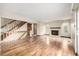 Bright living room featuring a fireplace and staircase at 2228 S Eldridge St, Lakewood, CO 80228