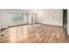 Spacious living room featuring hardwood floors and natural light from a large window at 2228 S Eldridge St, Lakewood, CO 80228