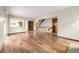 Open floorplan living room with staircase and kitchen access at 2228 S Eldridge St, Lakewood, CO 80228