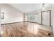 Bright living room with hardwood floors, a large window, and a vaulted ceiling at 2228 S Eldridge St, Lakewood, CO 80228