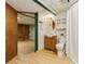 Functional bathroom featuring wooden cabinets, a toilet, and a shower with curtain at 1472 Sinton Rd, Evergreen, CO 80439