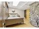 Comfortable bedroom featuring a stone accent wall and natural lighting at 1472 Sinton Rd, Evergreen, CO 80439