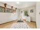 Playful bedroom with natural light, wood floors, and a decorative teepee for a cozy touch at 1472 Sinton Rd, Evergreen, CO 80439