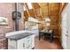 Cozy dining area featuring wood-paneled walls, beamed ceilings, and rustic charm at 1472 Sinton Rd, Evergreen, CO 80439
