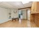Spacious living area with hardwood floors, stylish decor, and views of the kitchenette and bathroom at 1472 Sinton Rd, Evergreen, CO 80439