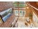 A bright living room featuring an exposed brick wall with hardwood floors and lots of natural light at 1472 Sinton Rd, Evergreen, CO 80439