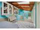 Bright sunroom featuring natural light, a hot tub, and a swing at 1472 Sinton Rd, Evergreen, CO 80439