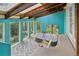 Bright sunroom featuring natural light, a hot tub, and a swing at 1472 Sinton Rd, Evergreen, CO 80439