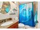 Bathroom showcases dolphin shower curtain, granite countertop, and modern fixtures at 18130 E Asbury Dr, Aurora, CO 80013