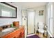 Bathroom features a glass shower enclosure, tiled floors, and modern vanity with granite countertop at 18130 E Asbury Dr, Aurora, CO 80013