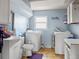 Convenient laundry room features washer, dryer, sink, toilet and ample storage space at 18130 E Asbury Dr, Aurora, CO 80013
