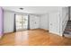 Bright living room with hardwood floors and large window at 18130 E Asbury Dr, Aurora, CO 80013