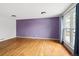 Living room with hardwood floors and large window at 18130 E Asbury Dr, Aurora, CO 80013