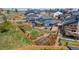 Aerial view of a fenced backyard with a patio, garden, and beautifully landscaped yard at 965 Arapahoe Cir, Louisville, CO 80027