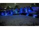 Backyard snow scene, lit with bright blue landscape lights at 965 Arapahoe Cir, Louisville, CO 80027