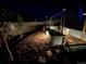 Backyard garden beds with fresh mulch and wooden fence at 965 Arapahoe Cir, Louisville, CO 80027