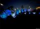Night view of a landscaped backyard illuminated with decorative lights at 965 Arapahoe Cir, Louisville, CO 80027