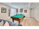 Finished basement with a pool table, wet bar, and ample space for entertaining guests at 965 Arapahoe Cir, Louisville, CO 80027