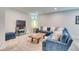 Finished basement with lounge area, modern sofas and neutral carpet at 965 Arapahoe Cir, Louisville, CO 80027