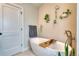 Elegant bathroom with a freestanding tub, modern fixtures, and minimalist decor at 965 Arapahoe Cir, Louisville, CO 80027