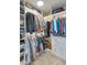Organized walk-in closet with ample storage, shelving, and hanging space for clothes and accessories at 965 Arapahoe Cir, Louisville, CO 80027