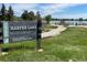 Scenic Harper Lake community sign in a park-like setting with walking trails and lake view at 965 Arapahoe Cir, Louisville, CO 80027
