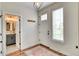 Welcoming entryway featuring hardwood floors, a convenient powder room, and stylish decor at 965 Arapahoe Cir, Louisville, CO 80027
