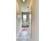 Inviting entryway with tile flooring and a white door, offering a glimpse of the outdoor greenery at 965 Arapahoe Cir, Louisville, CO 80027