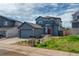 Attractive two-story home with an attached two car garage and a well-maintained front yard and landscaping at 965 Arapahoe Cir, Louisville, CO 80027