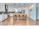 Modern kitchen with white cabinetry, stainless steel appliances, and a center island with seating at 965 Arapahoe Cir, Louisville, CO 80027