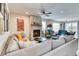 Bright living room with a stone fireplace, modern furniture, and ample natural light at 965 Arapahoe Cir, Louisville, CO 80027