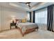 Cozy main bedroom featuring neutral tones, a comfortable bed, and large bright windows at 965 Arapahoe Cir, Louisville, CO 80027