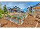 Lush backyard featuring raised garden beds, creating a beautiful and functional space for gardening enthusiasts at 965 Arapahoe Cir, Louisville, CO 80027